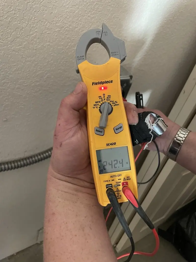 Voltage testing with clamp meter during Electrical Installation Services in Cookeville